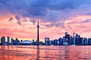 The skyline of Toronto, Ontario, Canada from Lake Ontario, showing the CN Tower and other large city buildings